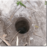 Photo of the hole in the sand left once the 110mm pipe was removed